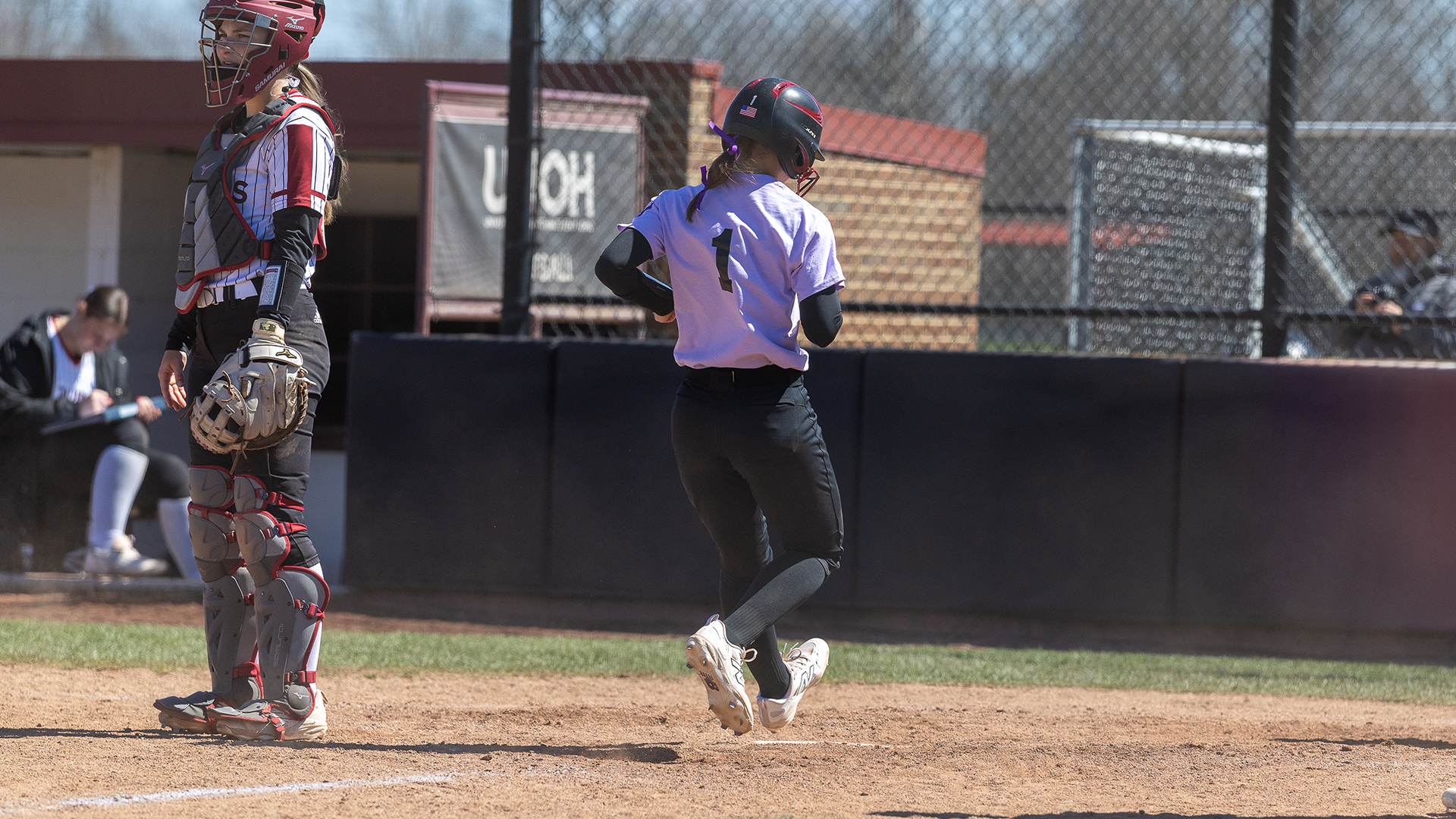 Racers Earn Doubleheader Split with Aquinas
